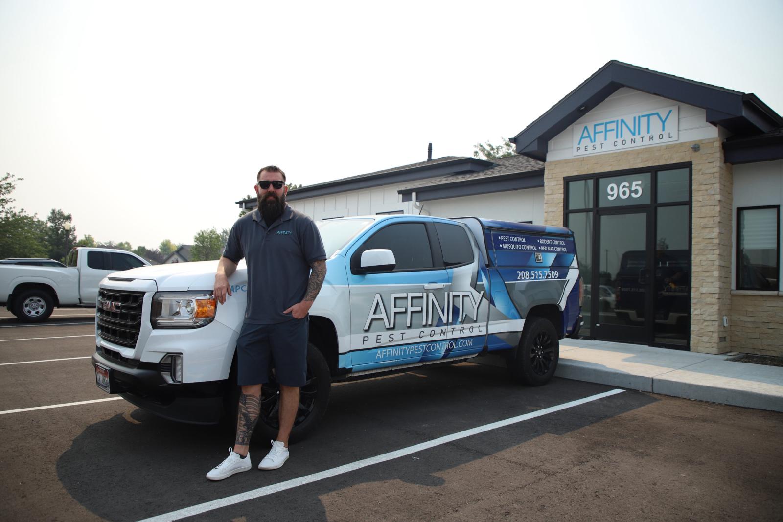 scott from affinity pest control standing in front of his work truck 