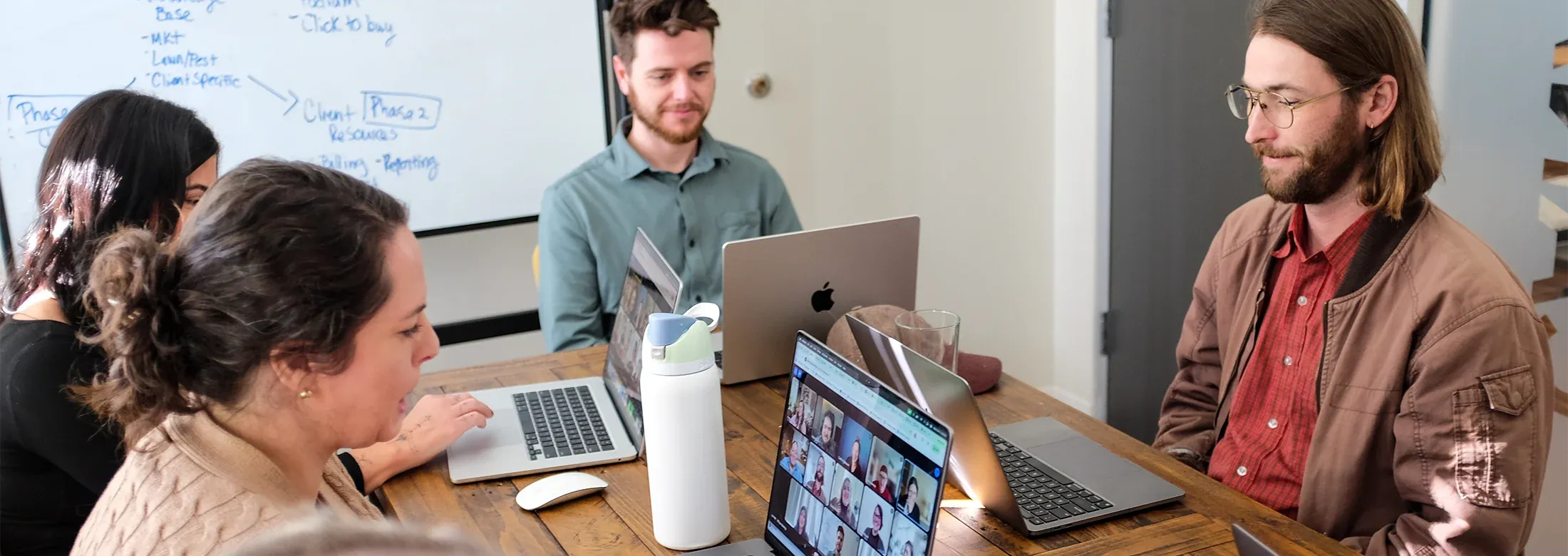 coalmarch marketing team discussing strategy in office meeting