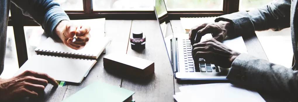 working at desk with laptop